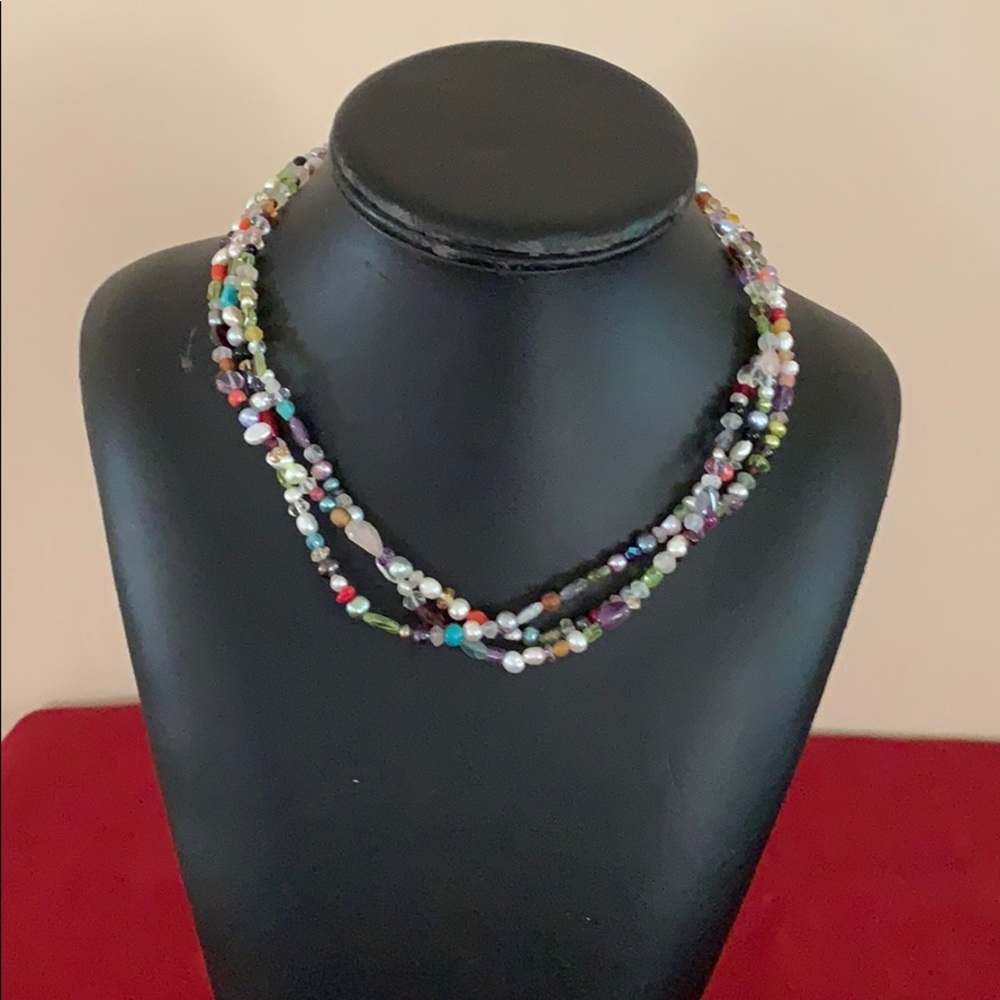 Women’s beats and pearl necklace